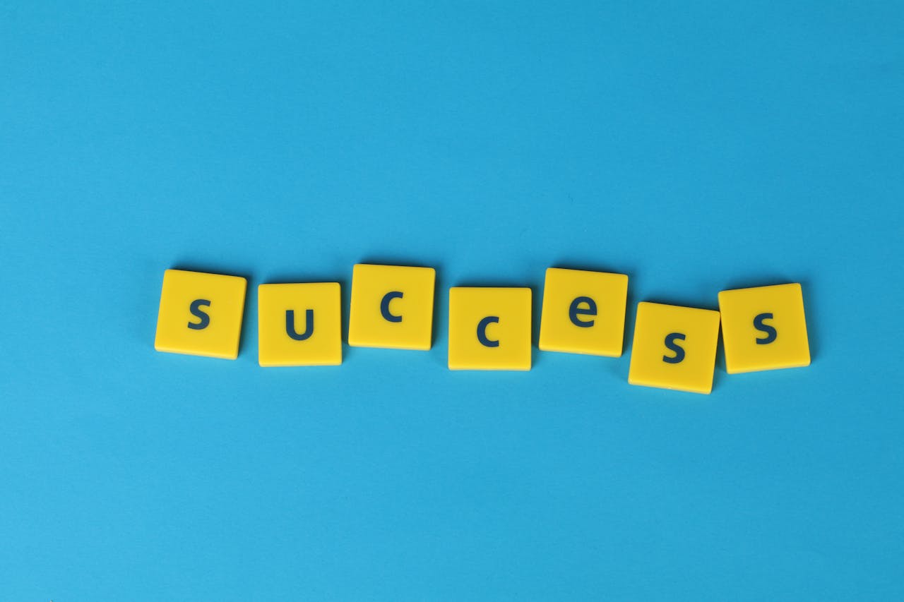 Mastering the First Impression: Your intriguing post title goes here Yellow letter tiles spell the word success on a vibrant blue backdrop, symbolizing achievement.